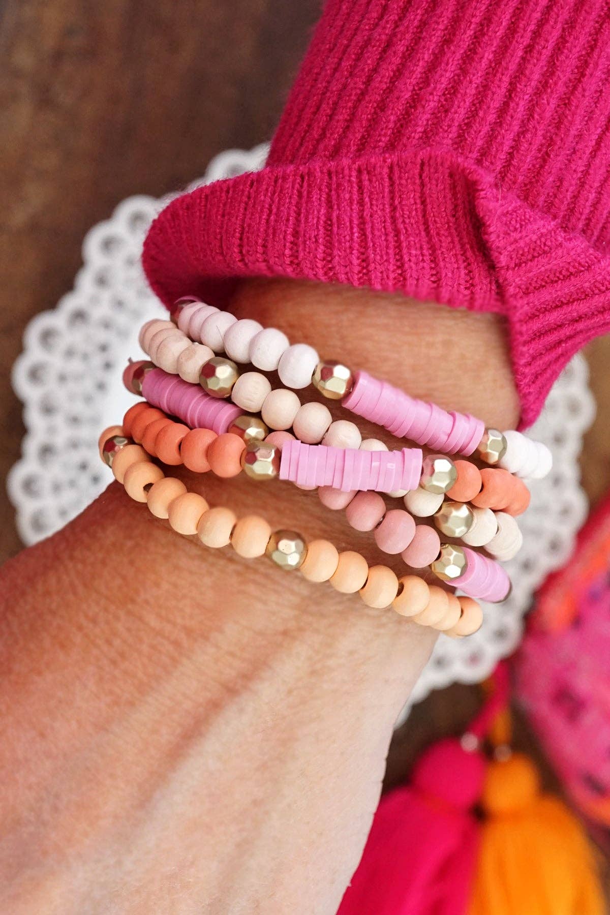 Pink stack of 5 clay and wood beads bracelets in pinks, whit