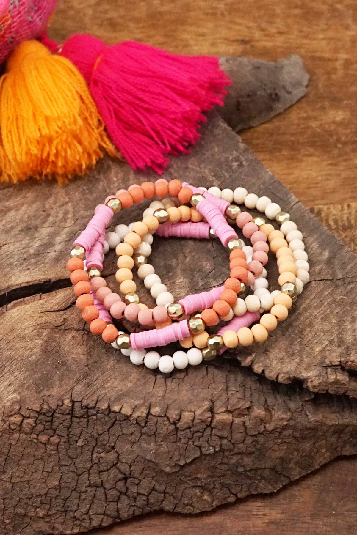 Pink stack of 5 clay and wood beads bracelets in pinks, whit