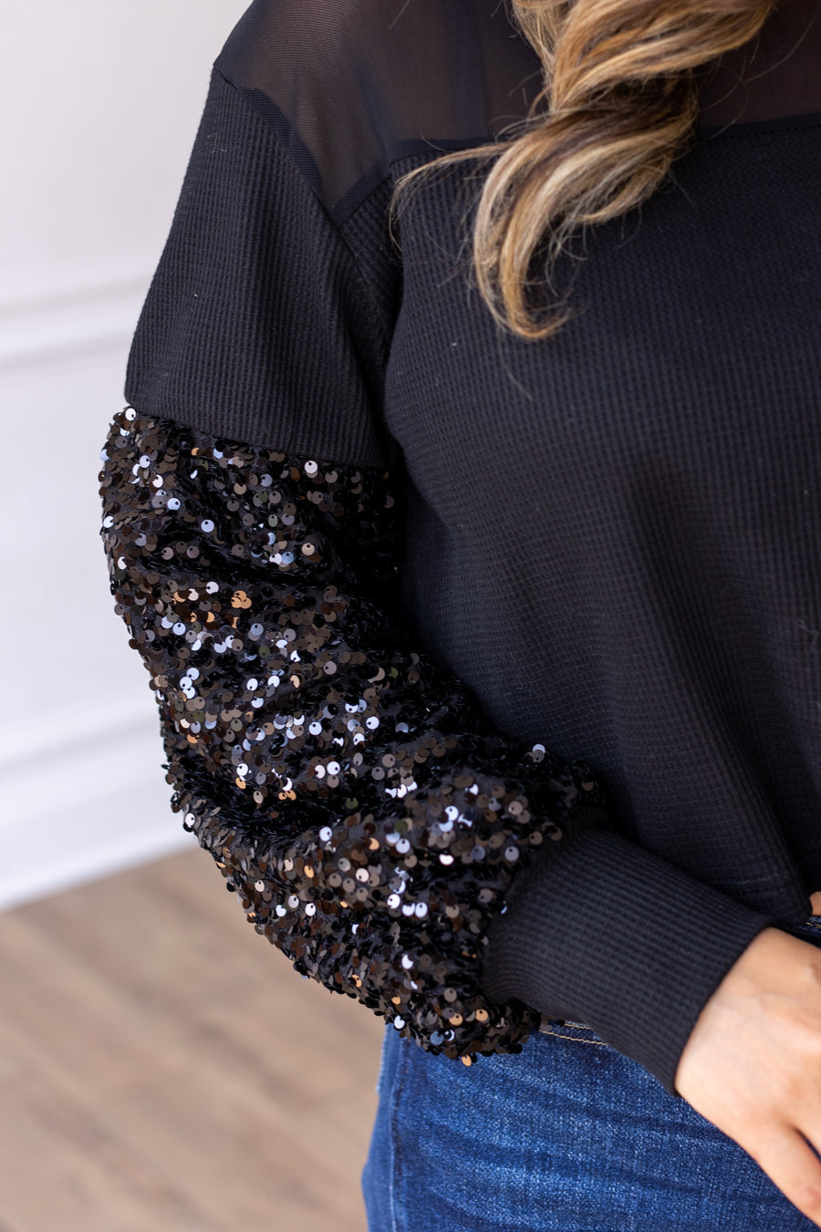 BLACK WAFFLE KNIT TOP WITH MESH AND SEQUIN DETAILS